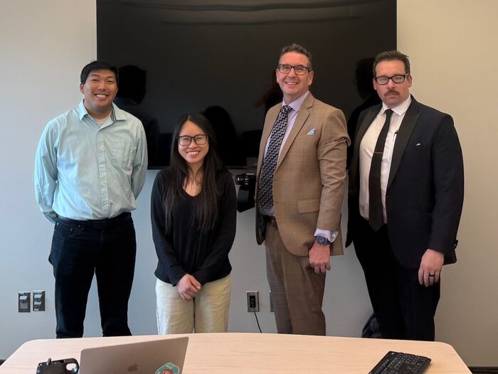Troy Cox with Thi Ngoc Bich Nguyen and committee members at her portfolio defense