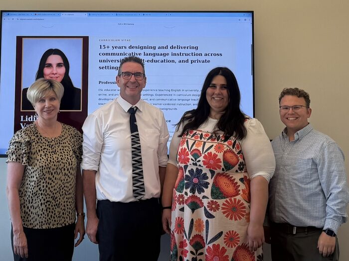 Troy Cox with Lidija Vasica and committee members, her portfolio CV shown on screen